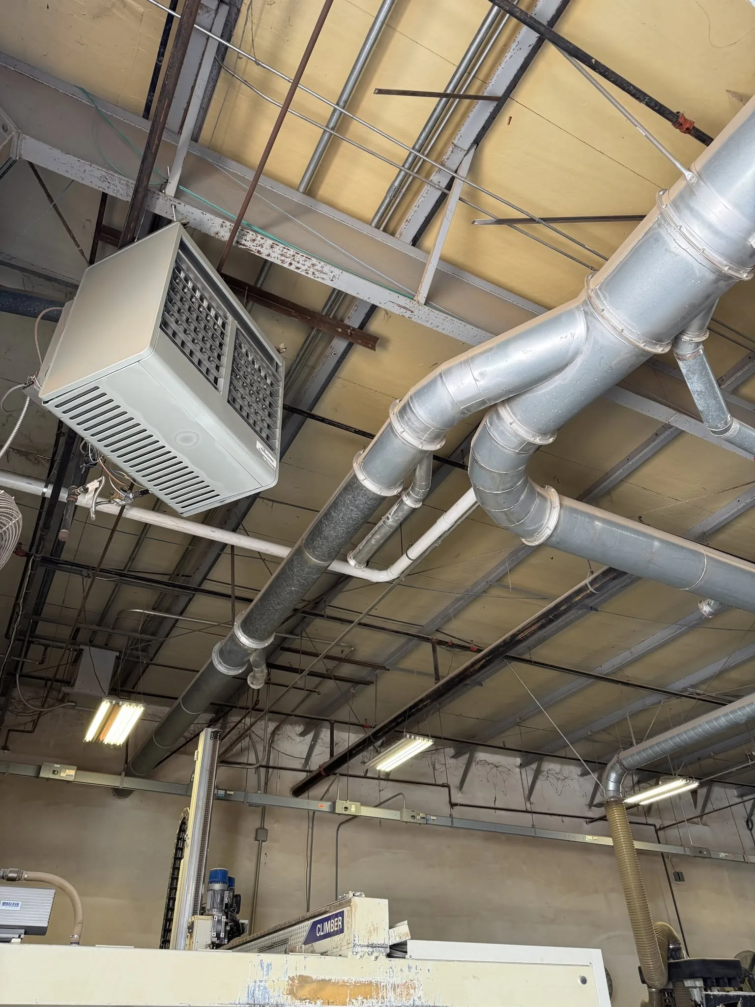 Overhead HVAC ductwork installation in a commercial facility — RSC Construction Solutions, Brevard County, FL.