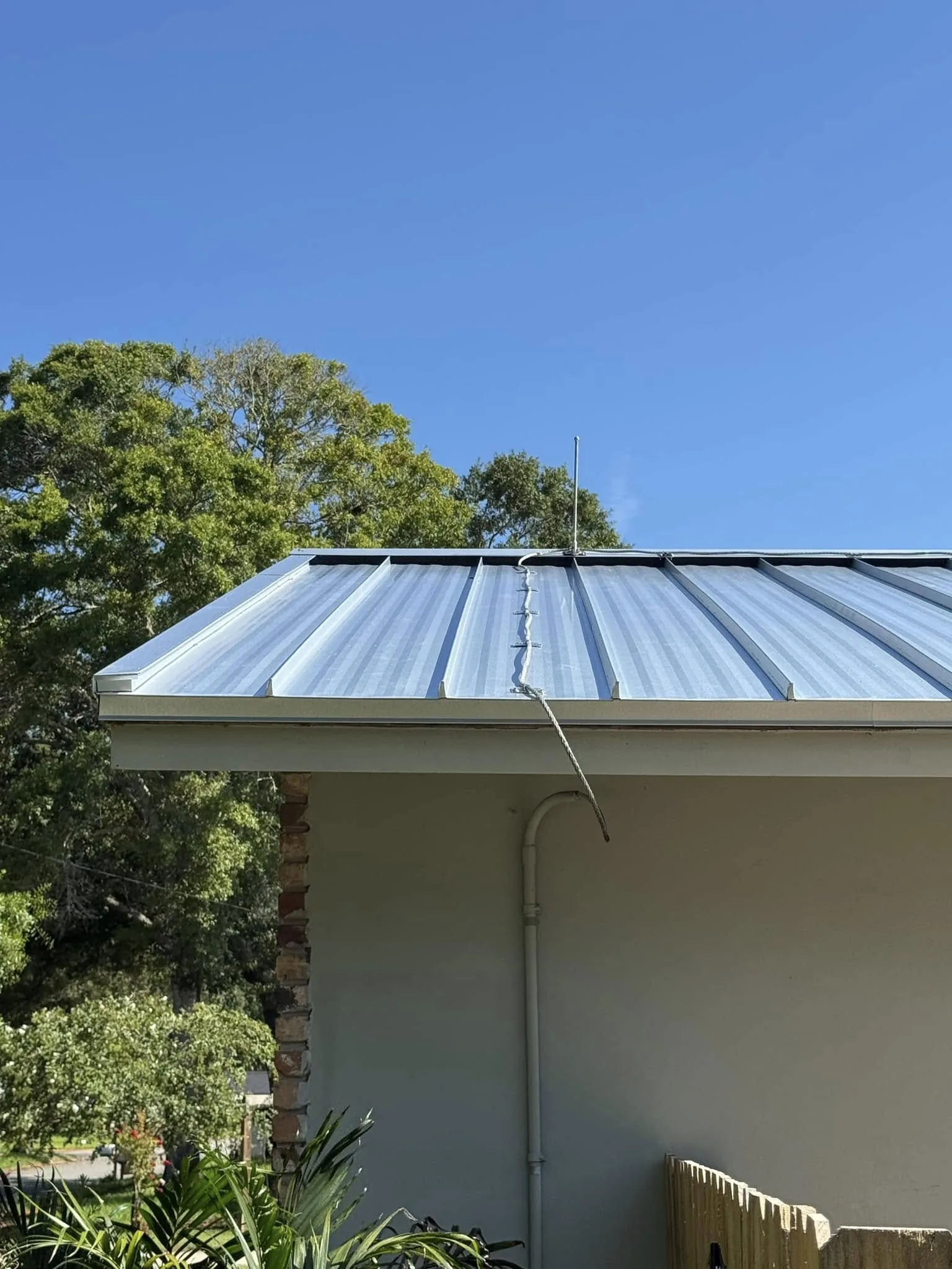 Metal roofing panels being installed on a building in Brevard County, FL.