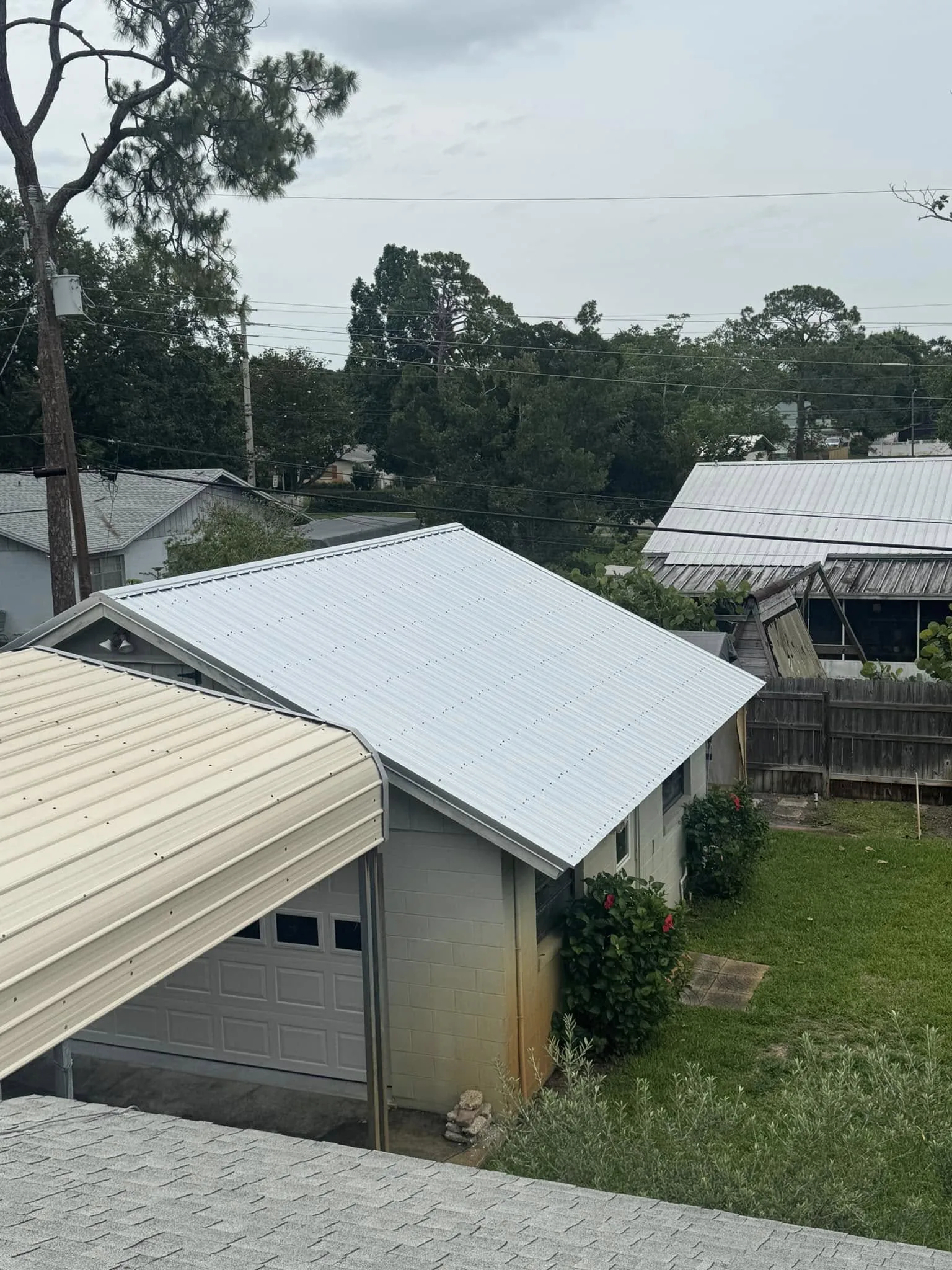 Side view of a completed metal roof on a residential structure.
