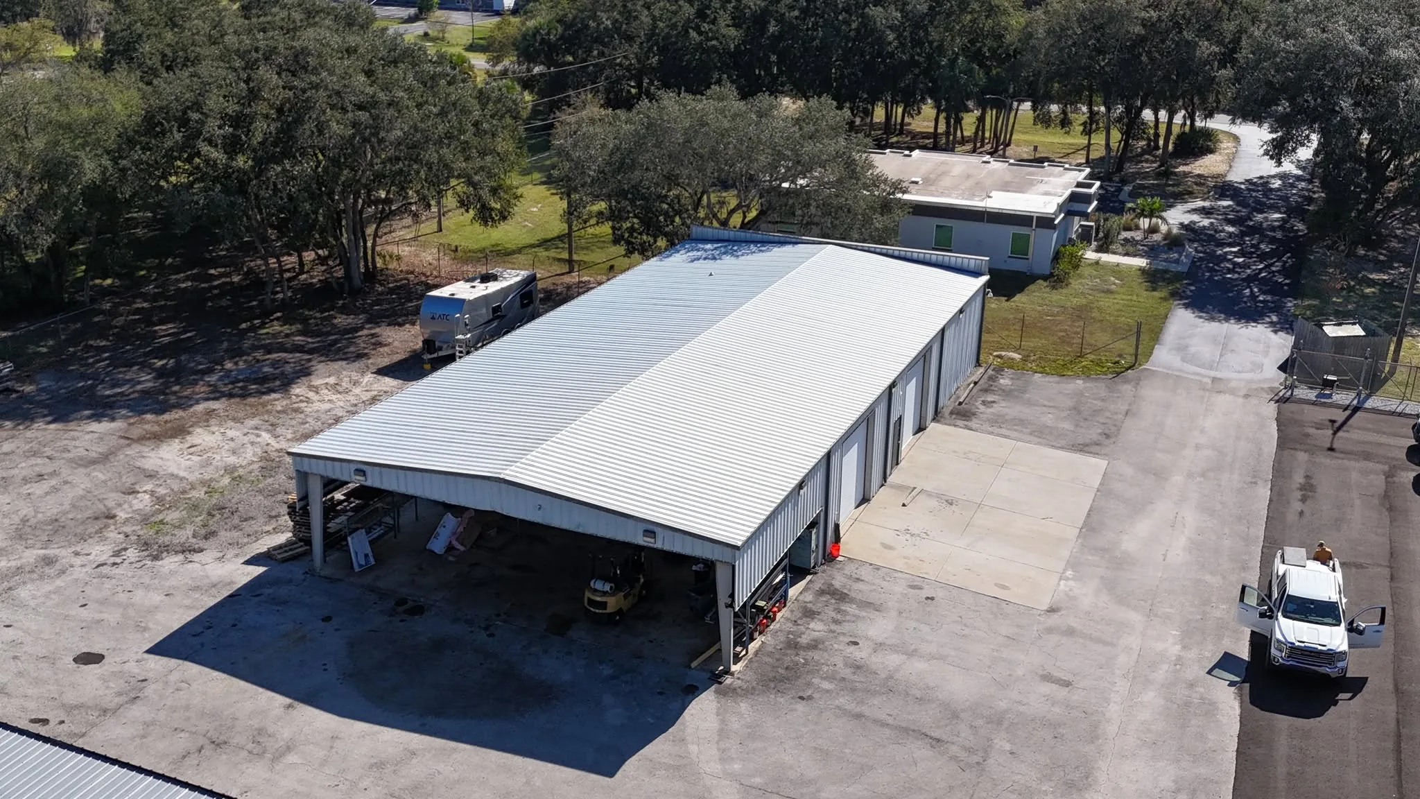 Aerial view of a completed commercial steel building and surrounding property.