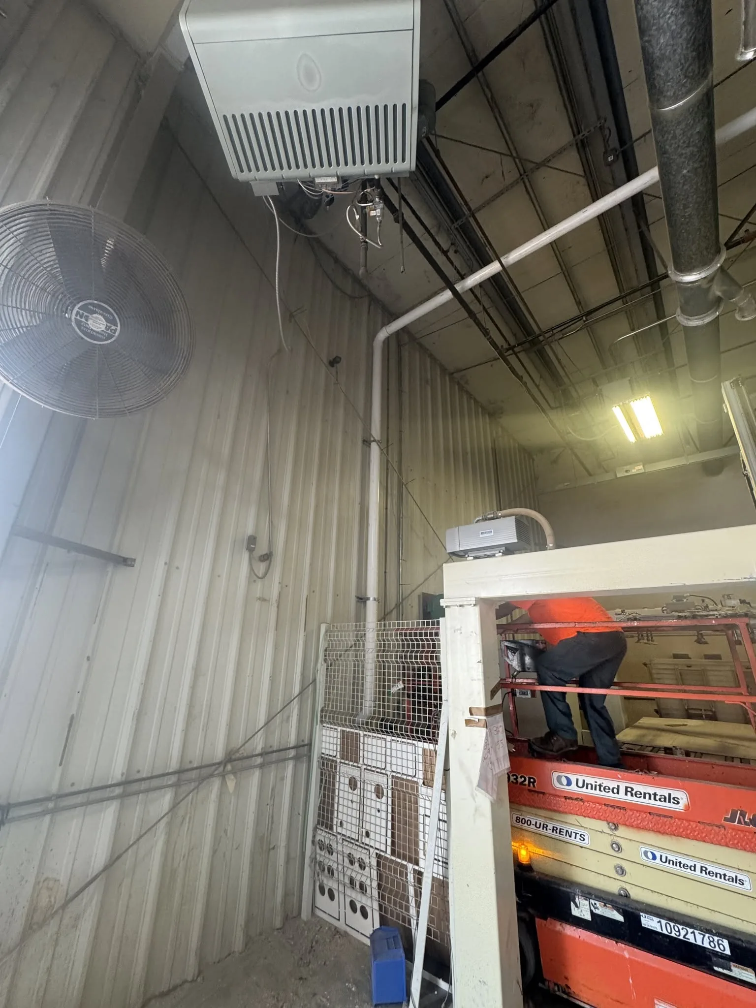 Finished interior of a commercial steel building with equipment.