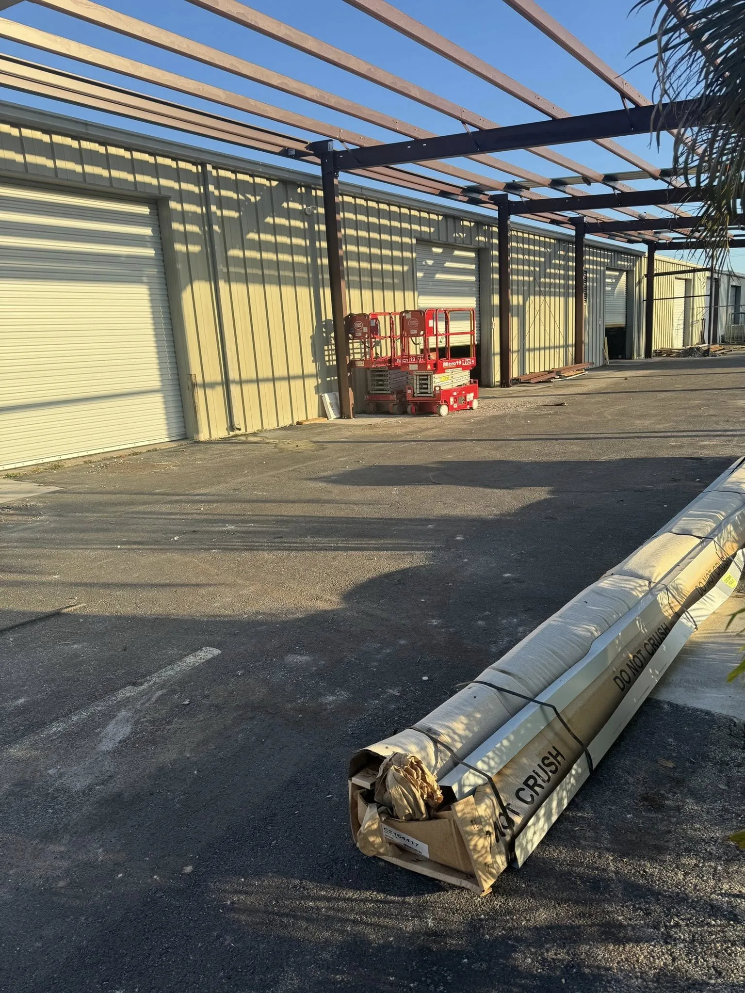 Steel structural frame being erected on a commercial building site.